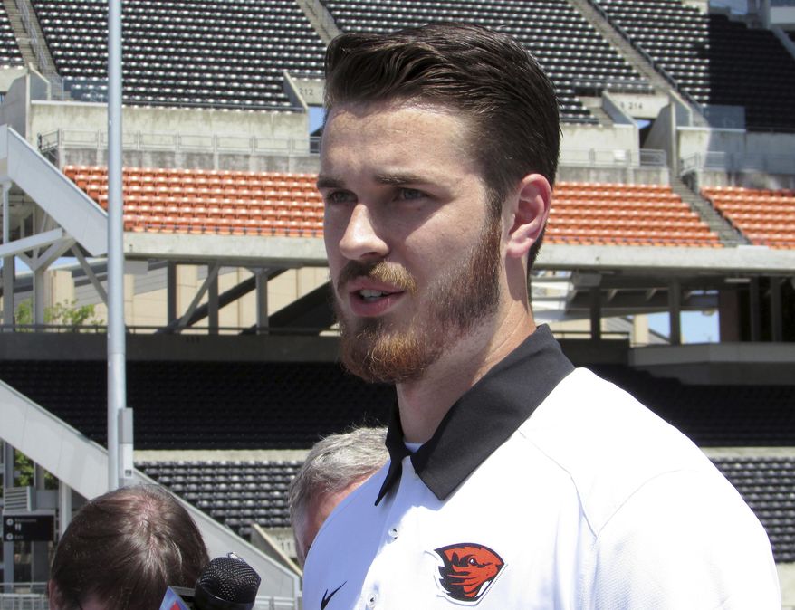 Oregon State quarterback Jake Luton speaks to reporters at Reser Stadium in Corvallis, Ore., on Tuesday, July 18, 2017, before the start of fall camp. Luton has been named the Beavers’ starter for the upcoming season. (AP Photo/Anne M. Peterson)