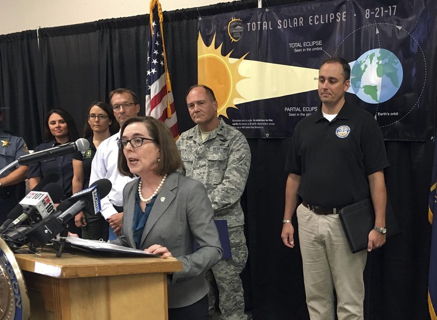 Oregon Gov. Kate Brown speaks in Salem, Ore., on Tuesday, Aug. 15, 2017 about the coming eclipse that will cross Oregon on Aug. 21, 2017. The state is bracing for as many as 1 million visitors to the state, which will be the first to experience the eclipse as it travels across America. (AP Photo/Andrew Selsky)