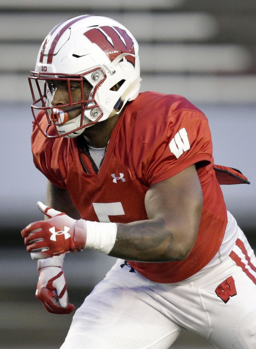 FILE- In this April 21, 2017, photo, Wisconsin running back Chris James (5) prepares to take a handoff during a spring football game in Madison, Wis. The running back sat out a year after leaving Pittsburgh to move to Madison, looking for a better backfield opportunity. (M.P. King/Wisconsin State Journal via AP, File)