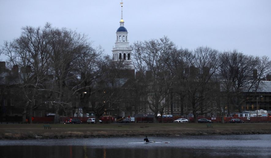 A rower paddles down the Charles River near the campus of Harvard University in Cambridge, Mass., Tuesday, March 7, 2017. (AP Photo/Charles Krupa) (Associated Press)