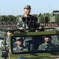 In this file photo taken Sunday, July 30, 2017, and released by Xinhua News Agency, Chinese President Xi Jinping stands on a military jeep as he inspects troops of the People&#39;s Liberation Army during a military parade to commemorate the 90th anniversary of the founding of the PLA at Zhurihe training base in north China&#39;s Inner Mongolia Autonomous Region. (Li Gang/Xinhua via AP) ** FILE **