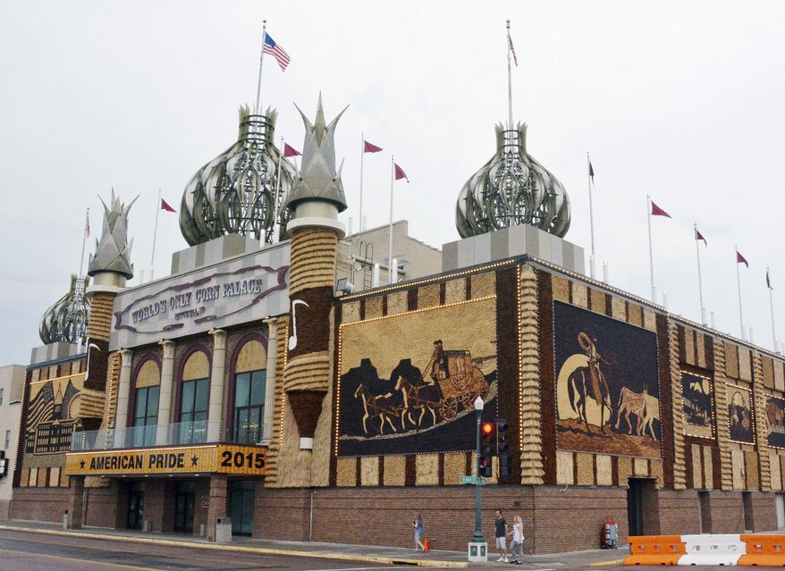 FILE - This Sept. 1, 2015, file photo shows the Corn Palace in Mitchell, S.D. The corn-themed tourist destination will have enough corn to decorate murals despite a dry summer. The director of the Corn Palace said that the city has enough corn to create the nine corn murals surrounding the facility thanks to recent rain. About 275,000 ears of corn are needed for the building, which is currently adorned with 2-year-old dilapidated murals. One city councilwoman says the building is a "community icon." (AP Photo/Dirk Lammers, File)