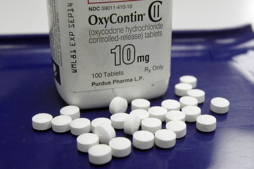 This Feb. 19, 2013, file photo shows OxyContin pills arranged for a photo at a pharmacy in Montpelier, Vt. A report found drug overdose deaths among U.S. teens inched up in 2015 after years of decline. The report was released on Wednesday, August 16, 2017, by the Centers for Disease Control and Prevention. (AP Photo/Toby Talbot, File) ** FILE **