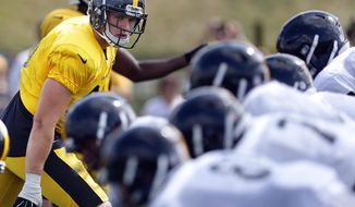 Pittsburgh Steelers linebacker T.J. Watt, left, lines up in drills during NFL football training camp in Latrobe, Pa., Wednesday, Aug. 16, 2017. The rookie linebacker had two sacks in his preseason debut last week, leaving both the Steelers coaching staff and older brother J.J. impressed.(AP Photo/Keith Srakocic)