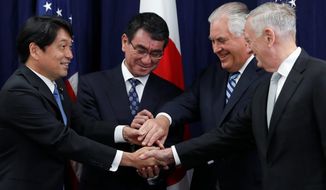 Japanese Defense Minister Itsunori Onodera (left) Japanese Foreign Minister Taro Kono, Secretary of State Rex W. Tillerson, and Defense Secretary James Mattis, gather at the start of acommittee meeting, Thursday at the State Department in Washington. (Associated Press)