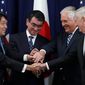 Japanese Defense Minister Itsunori Onodera (left) Japanese Foreign Minister Taro Kono, Secretary of State Rex W. Tillerson, and Defense Secretary James Mattis, gather at the start of acommittee meeting, Thursday at the State Department in Washington. (Associated Press)