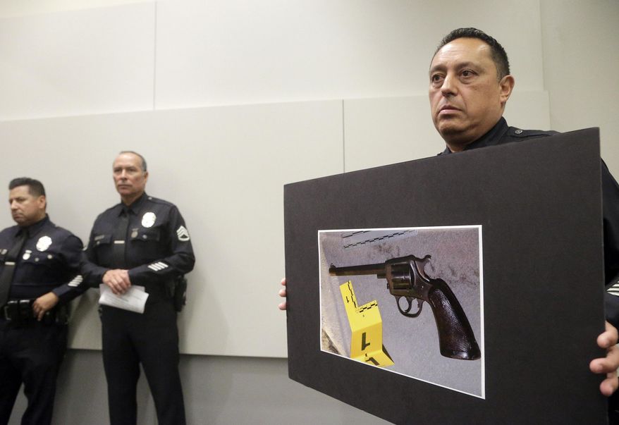 FILE - In this Aug. 10, 2016, file photo, Los Angeles Police officer Lt. Chris Ramirez holds a photo of a gun at a news conference while addressing a case in which a 14-year-old boy was killed by a police officer after the boy had fired on the officer, in Los Angeles. More than 150 people died during encounters with California police last year, the state attorney general&#x27;s office said Thursday, Aug. 17, 2017. The report by Attorney General Xavier Becerra marks the first time California has released data on police use of force encompassing all 800 of the state&#x27;s police departments. (AP Photo/Nick Ut, File)