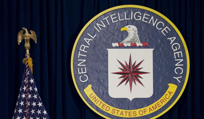 This April 13, 2016, file photo shows the seal of the Central Intelligence Agency at CIA headquarters in Langley, Va. (AP Photo/Carolyn Kaster, File)  ** FILE **