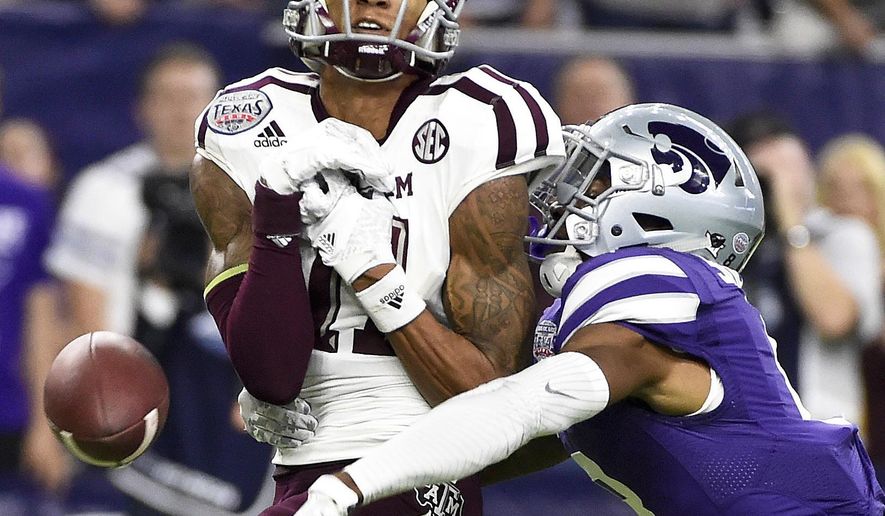 FILE - In this Dec. 28, 2016, file photo, Kansas State defensive back Duke Shelley, right, breaks up a pass intended for Texas A&M wide receiver Josh Reynolds during the second half of the Texas Bowl NCAA college football game, in Houston. The school that once produced Chris Canty and Thorpe Award winner Terrence Newman has struggled to defend the pass in recent years. But with Duke Shelley and a host of others back this season, Kansas State could be back to being DB U. (AP Photo/Eric Christian Smith, File)