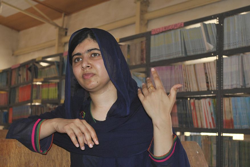 FILE - A Tuesday, July. 18, 2017 file photo of Nobel Peace laureate, Malala Yousafzai, gesturing, during a visit to school in Maiduguri Nigeria. Malala Yousafzai has gained a place at the University of Oxford. The 20-year-old education activist tweeted her acceptance to the school, saying she was "so excited" to win a spot to study philosophy, politics and economics. (AP Photo/ Jossy Ola, File)