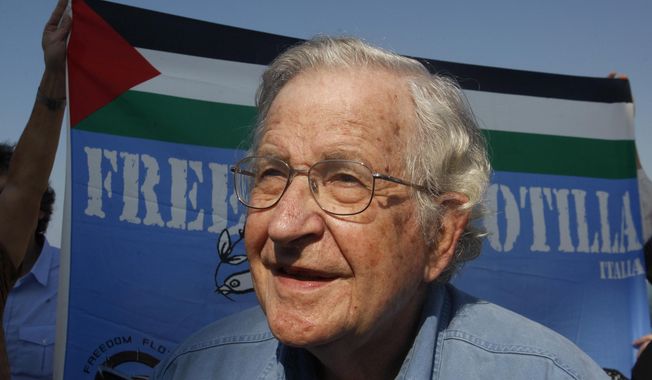 FILE - In this Oct. 20, 2012, file photo. Jewish-American scholar and activist Noam Chomsky stands during a press conference to support the Gaza-bound flotilla in the port of Gaza City. Chomsky is joining the faculty of the University of Arizona this month and will start teaching part-time in 2018. The 88-year-old professor has been a regular guest speaker and has taught at the school for the past five years. (AP Photo/Hatem Moussa, File)