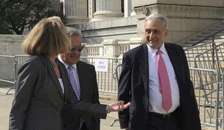 FILE- In this June 22, 2017 file photo,  Carl Paladino, right, walks with his lawyers outside the state Department of Education building in Albany, N.Y. The one-time Republican candidate for New York governor whose insults of Barack and Michelle Obama preceded calls for his ouster from the Buffalo school board has been removed from the post.  State Education Commissioner MaryEllen Elia announced her decision Thursday, Aug. 17, following a five-day hearing in June. School board members lobbied for Paladino&#39;s removal after he disclosed information about teacher contract negotiations that were discussed in closed-door sessions. (AP Photo/Mary Esch, File)