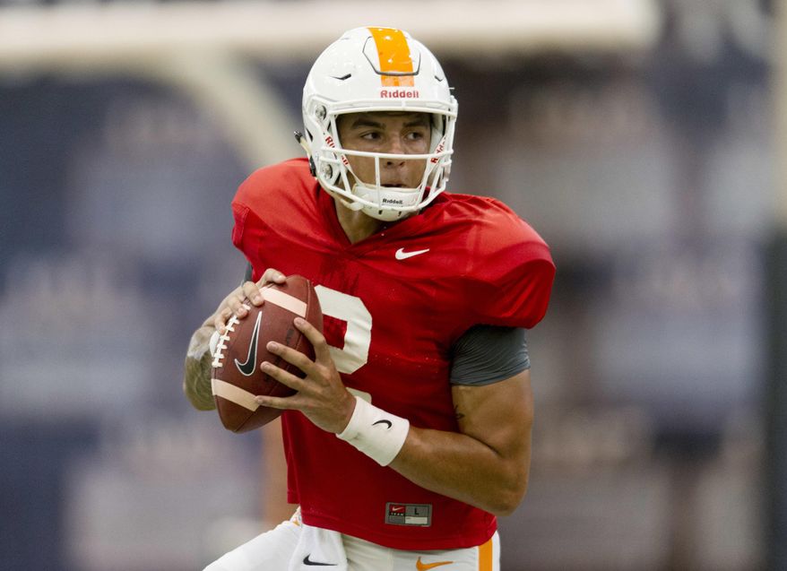 FILE - In this Tuesday, April 18, 2017 file photo, Tennessee quarterback Jarrett Guarantano (2) participates in the team's spring practice at Anderson Training Facility in Knoxville, Tenn. This could turn into a big year for redshirt freshman quarterbacks in the Southeastern Conference. It all depends on how a few preseason competitions turn out. Florida, Tennessee and Texas A&M all have redshirt freshman quarterbacks bidding for starting spots. None of the three schools has named a starter. Tennessee’s quarterback derby features redshirt freshman Jarrett Guarantano and junior Quinten Dormady. (Calvin Mattheis/Knoxville News Sentinel via AP, File)