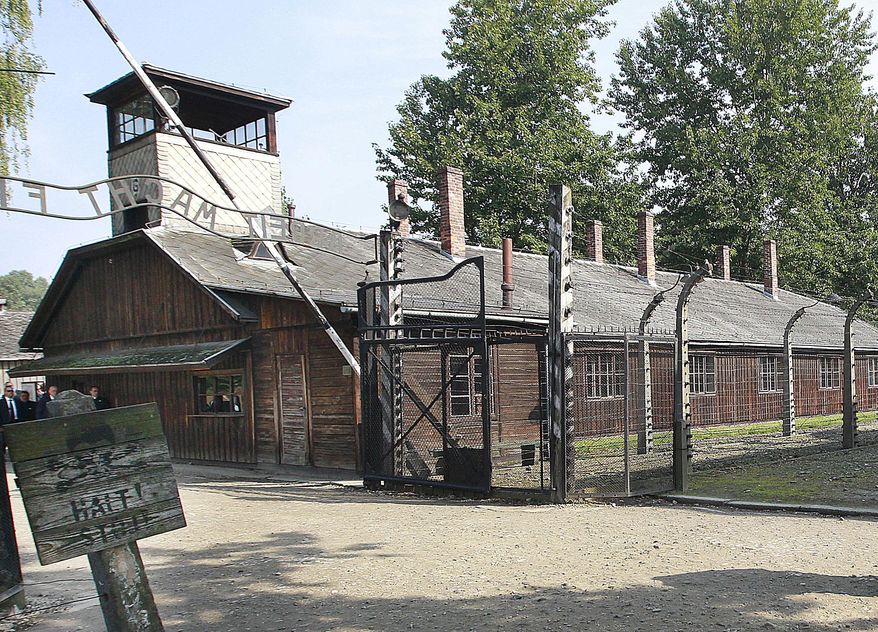 FILE - This file photo from July 29, 2016, shows the gate of the former German Nazi death camp of Auschwitz in Oswiecim, Poland. The museum and memorial site appears to have weighed in on the debate over U.S. President Donald Trump's response to the outpouring of anti-Semitic and racially charged hatred in Charlottesville, Virginia. The state museum wrote Thursday, Aug. 17, 2017, on Twitter: "One of the hardest lessons for us today. Perpetrators were people. They accepted an ideology that rationalized and promoted hatred & evil." (AP Photo/Czarek Sokolowski, File)