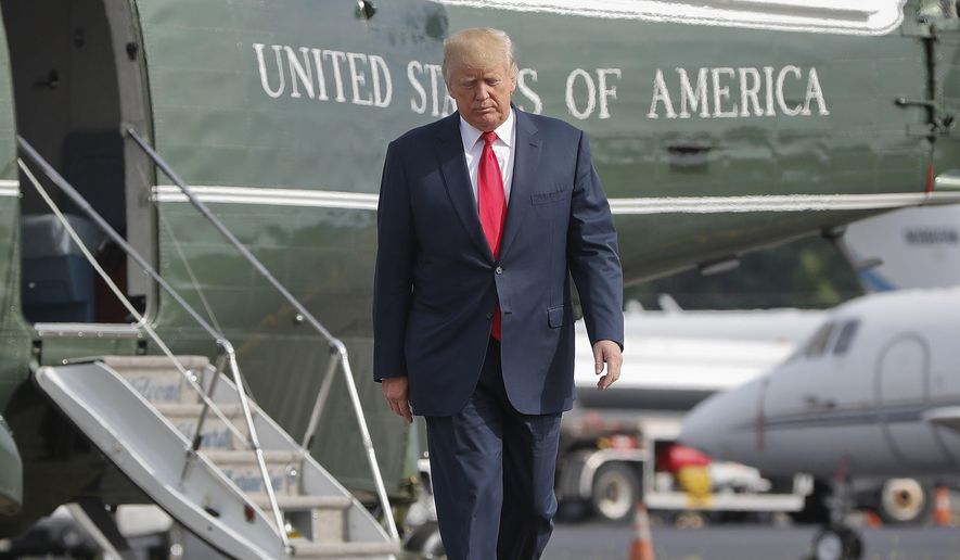 In this Aug. 14, 2017, file photo, President Donald Trump walks across the tarmac from Marine One to board Air Force One at Morristown Municipal Airport in Morristown, N.J. Bombarded by the sharpest attacks yet from fellow Republicans, President Donald Trump on Thursday, Aug. 17, 2017, dug into his defense of racist groups by attacking members of own party and renouncing the rising movement to pull down monuments to Confederate icons. (AP Photo/Pablo Martinez Monsivais, File)