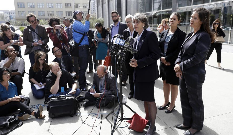 File - In this July 10, 2017 file photo, Oakland city officials including Mayor Libby Schaaf, right, city administrator Sabrina Landreth, second from right, and police chief Anne Kirkpatrick, at podium, field questions after a federal court hearing about police sexual misconduct in San Francisco. The teenage daughter of a police dispatcher at the center of a Northern California sexual misconduct scandal involving two dozen officers has filed suit against one of the law enforcement agencies, her attorney announced Friday, Aug. 18, 2017. The 19-year-old filed the federal lawsuit in San Francisco Thursday, Aug. 17, 2017. (AP Photo/Marcio Jose Sanchez, File)