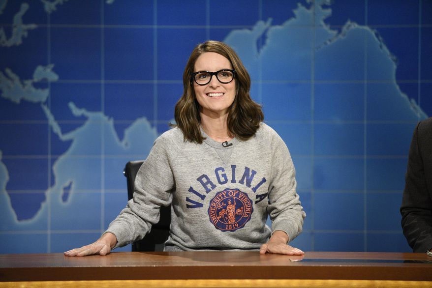 This Aug. 17, 2017, photo provided by NBC shows Tina Fey on set during the an episode of "Weekend Update: Summer Edition," in New York. Fey, a graduate of the University of Virginia, discussed last weekend's white nationalist rally near the school's Charlottesville, Va. campus, saying it broke her heart "to see these evil forces descend upon Charlottesville.” (Will Heath/NBC via AP)