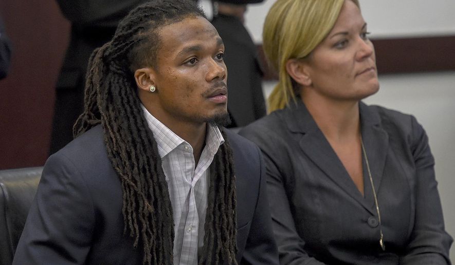 FILE - In this June 23, 2017, file photo, Brandon Banks, left, and his attorney Katie Hagan react after the verdict was read in his trial in Nashville, Tenn. Banks, a former Vanderbilt University football player, has been sentenced to 15 years in prison Friday, Aug. 18, 2017, for the 2013 rape of an unconscious female student. (Lacy Atkins/The Tennessean via AP, File)