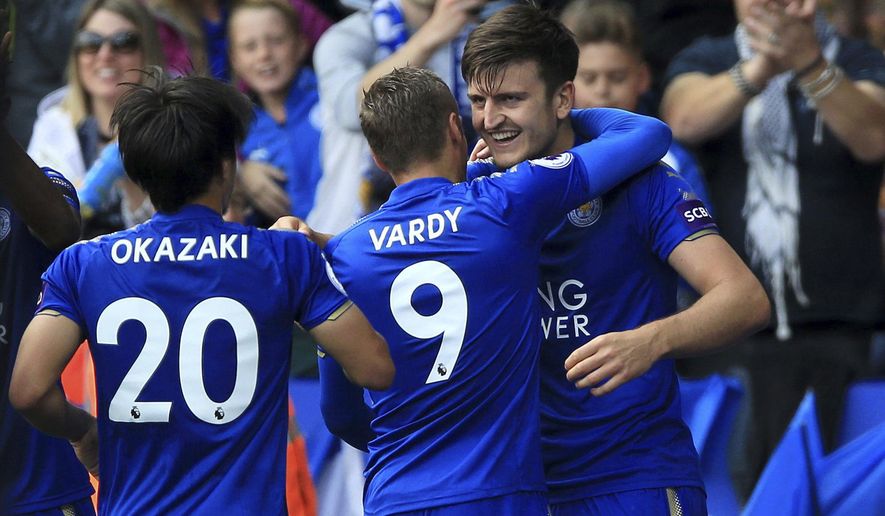 Leicester City&#x27;s Harry Maguire, right, celebrates scoring his side&#x27;s second goal during their English Premier League soccer match against Brighton at the King Power Stadium, Leicester, England, Saturday, Aug. 19, 2017. (Nigel French/PA via AP)