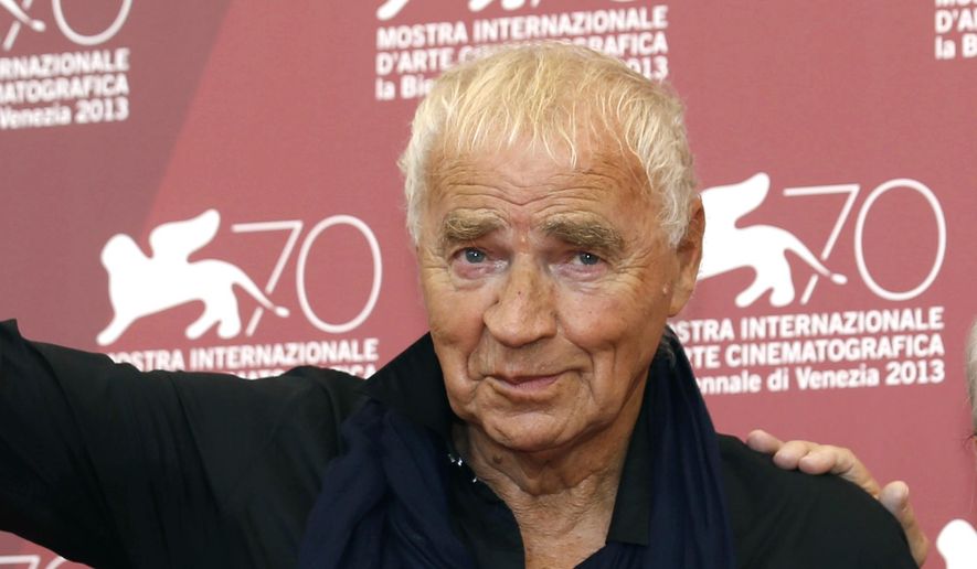 FILE - In this Thursday, Sept. 5, 2013 file photo, writer Janusz Glowacki poses for photographers with director Andrzej Wajda, during the photo call for the film Walesa. Man Of Hope, at the Venice Film Festival in Venice, Italy. The wife of renowned Polish-U.S. playwright and screenwriter Janusz Glowacki says he has died at 78, it was reported on Saturday, Aug. 19, 2017. Popular in New York and Polish artistic and intellectual circles, Glowacki was the author of award-winning plays "Antigone in New York" and "The Fourth Sister," which set classic themes in the contemporary world. (AP Photo/David Azia, File)