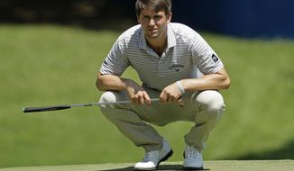 Ollie Schniederjans lines up a putt on the first hole during the third round of the Wyndham Championship golf tournament in Greensboro, N.C., Saturday, Aug. 19, 2017. (AP Photo/Chuck Burton)