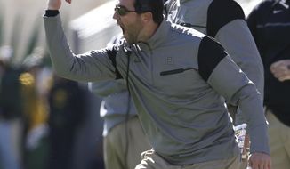 FILE - This Nov. 19, 2016 file photo shows Baylor offensive coordinator Kendal Briles reacting to a play against Kansas State in the first half of a NCAA college football game in Waco, Texas.  Florida Atlantic is offering a second chance to Briles. The Owls&#39; roster and coaching staff feature plenty of names of people who have encountered issues along the way to Boca Raton. Briles was the coordinator at Baylor under his father while the school was rocked by a sexual assault scandal. (Jerry Larson/Waco Tribune Herald via AP, file)