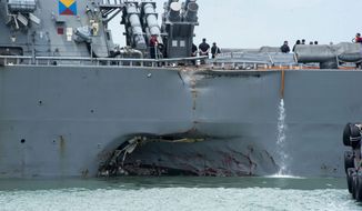 The USS John S. McCain was damaged on its portside during a collision with an oil tanker in the Pacific on Monday in Southeast Asian waters. Ten American sailors are lost at sea. A top U.S. Navy official hasn&#39;t yet ruled out that the collision was intentional. (Associated Press)