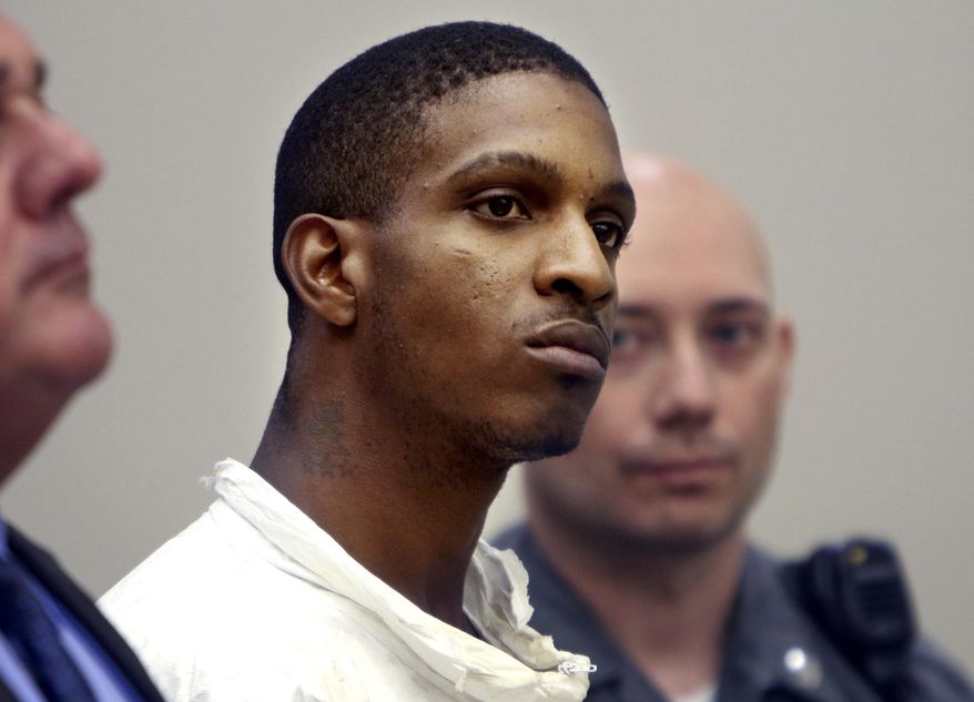 Anthony Rutherford listens during his arraignment in court in Waterbury, Conn., Monday, Aug. 21, 2017. Rutherford is accused of killing an anti-domestic violence activist and her 9-year-old daughter. (Steven Valenti/The Republican-American via AP, Pool)