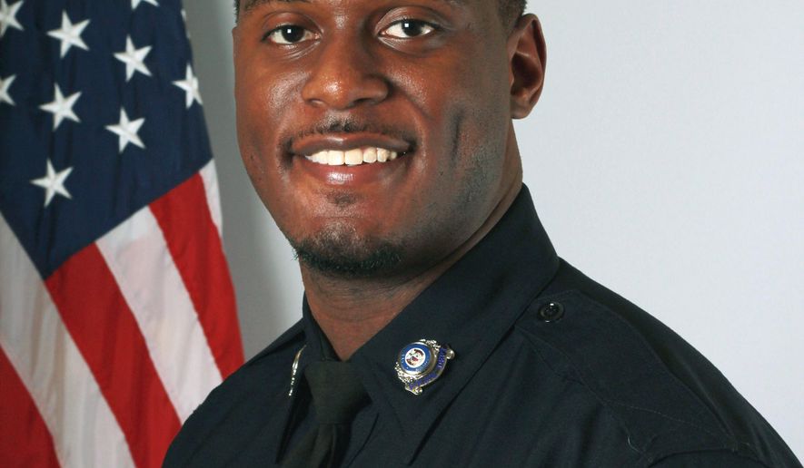 This undated photo provided by the Lees Summit Police Department in Lee's Summit, Mo., shows Officer Thomas Orr, who was fatally shot while off duty Sunday, Aug. 20, 2017, at a restaurant in the Westport bar and entertainment district in Kansas City. Police say the shooting happened after an argument broke out between patrons. (Lee's Summit Police Department via AP)