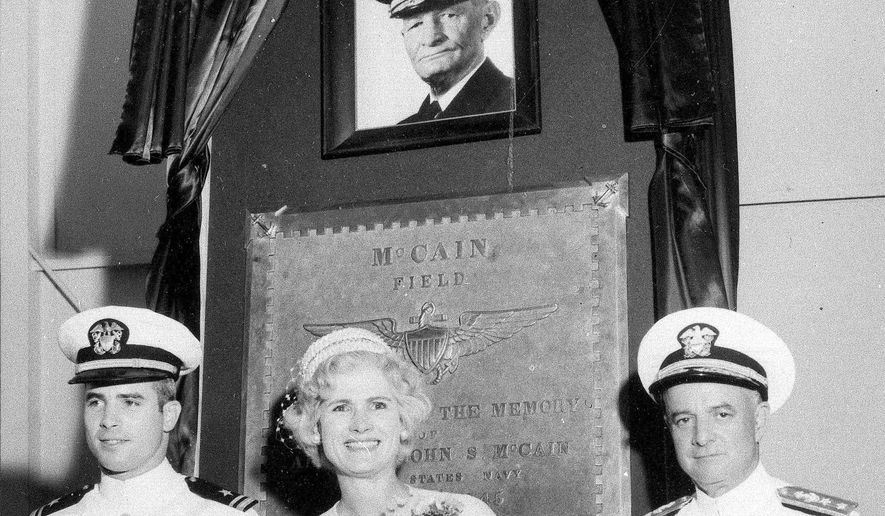 FILE - In this July 14, 1961, file photo, then Lt. John S. McCain III, left, and his parents, Rear Adm. John S. McCain Jr. and Roberta Wright McCain take part in the ceremony to commission McCain Field, the U.S. Navy training base in Meridian, Miss., named in honor of Adm. John S. McCain, in photo at top, respectively grandfather and father to the two McCains. Ten U.S. sailors are missing after a collision between the USS John S. McCain and a tanker early Monday, Aug. 21, 2017, east of Singapore, the second accident involving a ship from the Navy's 7th Fleet in the Pacific in two months. The 154-meter (505-foot) McCain is named after U.S. Sen. John McCain's father and grandfather, who were both U.S. admirals. (AP Photo/File)