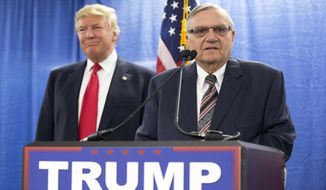 FILE - In this Jan. 26, 2016 file photo, then-Republican presidential candidate Donald Trump was joined by Joe Arpaio, the sheriff of metro Phoenix, during a news Trump was just a few weeks into his candidacy in 2015 when came to Phoenix for a speech that ended up being a bigger moment in his campaign than most people realized at the time. And now Trump is coming back to Arizona at another crucial moment in his presidency. (AP Photo/Mary Altaffer, File)