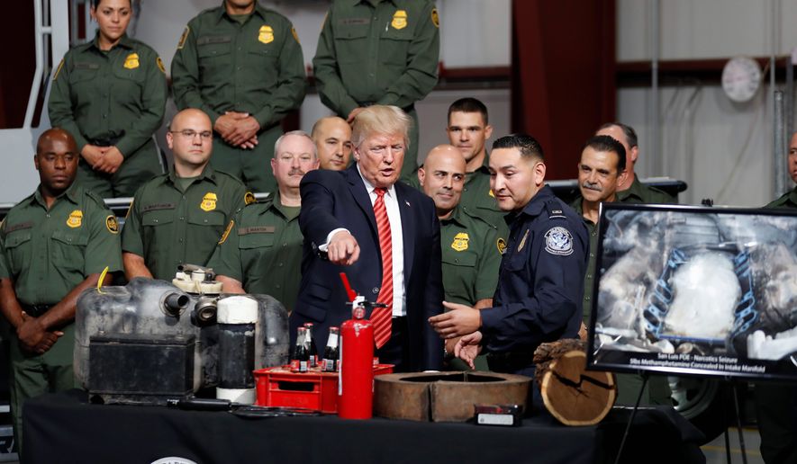 President Trump went to the Yuma, Arizona, border with Mexico Tuesday — which has seen a sharp drop-off in illegal border crossings due to stricter methods. Mr. Trump was then headed to a campaign-style rally in Phoenix. (Associated Press)