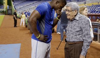 FILE - In this Wednesday, Aug. 21, 2013, file photo, Los Angeles Dodgers right fielder Yasiel Puig, left, talks with Spanish language broadcaster Rafael &amp;quot;Felo&amp;quot; Ramirez during batting practice before the Dodgers&#x27; baseball game against the Miami Marlins, in Miami. Ramirez, a Hall of Fame baseball radio broadcaster who was the signature voice for millions of Spanish-speaking sports fans over three decades, died Monday, Aug. 21, 2017. He was 94. (AP Photo/Lynne Sladky, File)