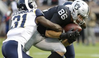 Oakland Raiders tight end Lee Smith (86) catches a touchdown pass against Los Angeles Rams free safety Maurice Alexander (31) during the first half of an NFL preseason football game in Oakland, Saturday, Aug. 19, 2017. (AP Photo/Rich Pedroncelli)