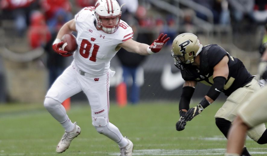 File-This Nov. 19, 2016, file photo shows Wisconsin tight end Troy Fumagalli (81) trying to get past Purdue linebacker Andy James Garcia (42) during the first half of an NCAA college football game in West Lafayette, Ind. Fumagalli was named to the second team AP Preseason All-America Team on Tuesday, Aug. 22, 2017. (AP Photo/Michael Conroy, File)