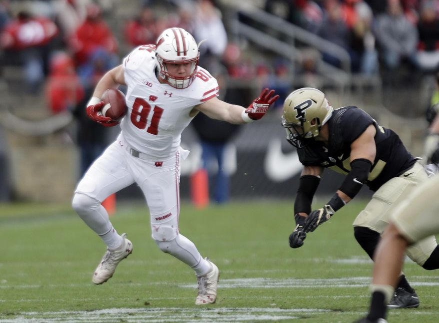 File-This Nov. 19, 2016, file photo shows Wisconsin tight end Troy Fumagalli (81) trying to get past Purdue linebacker Andy James Garcia (42) during the first half of an NCAA college football game in West Lafayette, Ind. Fumagalli was named to the second team AP Preseason All-America Team on Tuesday, Aug. 22, 2017. (AP Photo/Michael Conroy, File)