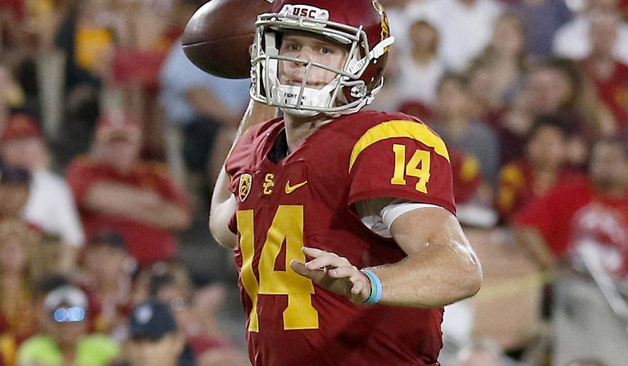FILE - In this Oct. 1, 2016, file photo, Southern California quarterback Sam Darnold (14) throws a touchdown pass to wide receiver JuJu Smith-Schuster (9) during the first half of an NCAA college football game in Los Angeles. Darnold and Penn State Saquon Barkley put on a show at the Rose Bowl to end last season, and established themselves as two of the biggest stars in college football coming into 2017. Now the two Heisman Trophy contenders highlight The Associated Press preseason All-America team released Tuesday. (AP Photo/Ryan Kang, File)