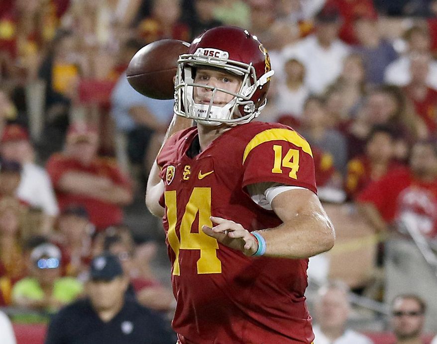 FILE - In this Oct. 1, 2016, file photo, Southern California quarterback Sam Darnold (14) throws a touchdown pass to wide receiver JuJu Smith-Schuster (9) during the first half of an NCAA college football game in Los Angeles. Darnold and Penn State Saquon Barkley put on a show at the Rose Bowl to end last season, and established themselves as two of the biggest stars in college football coming into 2017. Now the two Heisman Trophy contenders highlight The Associated Press preseason All-America team released Tuesday. (AP Photo/Ryan Kang, File)
