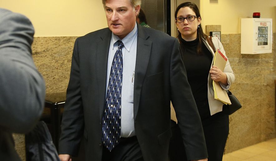 FILE - in this Friday, June 30, 2017, file photo, Shannon Kepler, left, arrives with his legal team for afternoon testimony in his third trial in Tulsa, Okla. Kepler, a former Tulsa, Okla., police officer facing a fourth trial in the killing of his daughter's black boyfriend has been referred to as white since the 2014 shooting. Now, he is claiming membership in an American Indian tribe, and says it's up to federal prosecutors to try him. (AP Photo/Sue Ogrocki, File)