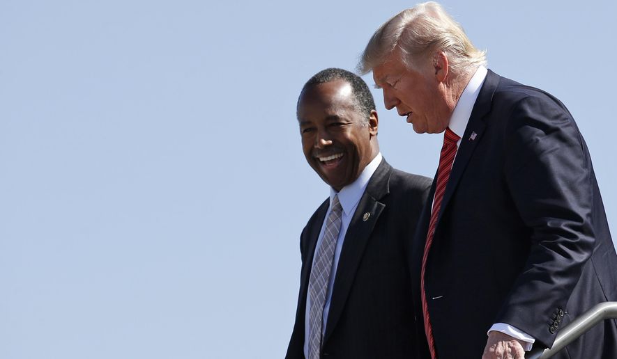 In this file photo, President Trump and Housing and Urban Development Secretary Ben Carson step off Air Force One upon their arrival in Reno, Nev., Wednesday, Aug. 23, 2017. Mr. Trump is rescinding President Obama&#39;s Affirmatively Furthering Fair Housing (AFFH) rule and replacing it with guidance called the Preserving Community and Neighborhood Choice, Mr. Carson announced on July 23, 2020. (AP Photo/Alex Brandon) **FILE**