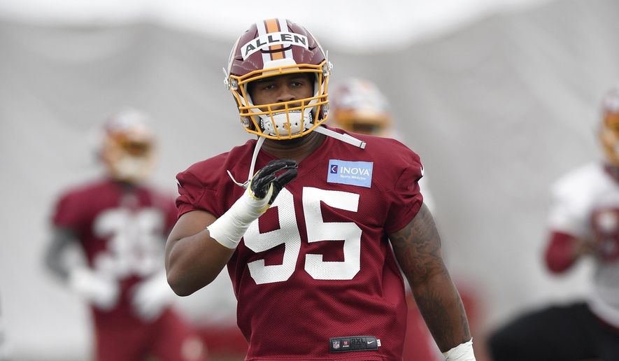FILE - In this May 13, 2017, file photo, Washington Redskins defensive lineman Jonathan Allen warms up during an NFL football rookie minicamp in Ashburn, Va. It&#39;s not a coincidence that the Washington Redskins used their first two draft picks on players out of Alabama. Allen and linebacker Ryan Anderson should be immediate impact players in the NFL because of their pro-style preparation in college. (AP Photo/Nick Wass, File) **FILE**