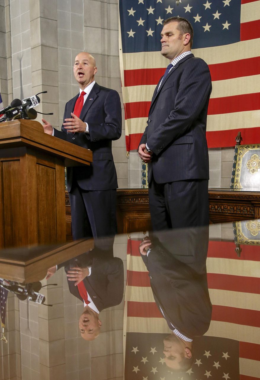 In this Aug. 3 2017 photo, Nebraska Gov. Pete Ricketts, left, and Chief Human Resources Officer Jason Jackson speak in Lincoln, Neb., during a news conference to release the findings of an internal investigation that led to the firing of Nebraska State Patrol superintendent Brad Rice in June. A review by Gov. Pete Ricketts' office faulted patrol leaders for failing to document Nebraska rooper Brienne Splittgerber's complaints that she was forced to undergo unnecessary, sexually invasive medical exams, and investigate the allegations. The review also faulted Rice, who was fired by Ricketts in July, for failing to correct the agency's inaction after he learned about it in February. (AP Photo/Nati Harnik)