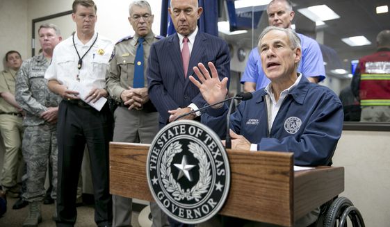 Gov. Greg Abbott speaks at a news conference about Hurricane Harvey at the State Operations Center in Austin, Texas, on Friday, Aug. 25, 2017. Hurricane Harvey is shaping up as just about a worst-case scenario storm with possible flooding from two different directions. ( Jay Janner/Austin American-Statesman via AP)