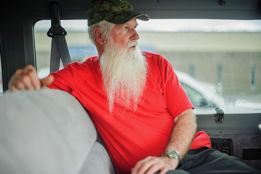 In this undated photo, James Green, co-leader of the Aggressive Christianity Missions Training Corps, waits in the parking lot of the Cibola County Magistrate Court in Grants, N.M. Four members of the New Mexico paramilitary religious sect rocked by child sexual abuse allegations were arrested while trying to flee the state in two vans full of children, authorities said Thursday, Aug. 24, 2017. (Adron Gardner/Gallup Independent via AP)