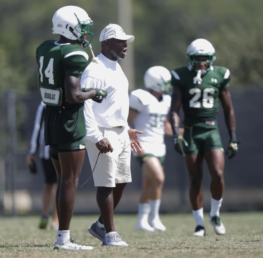 South Florida head football coach Charlie Strong watches practice in Tampa, Fla., Tuesday, Aug. 22, 2017. (Octavio Jones/Tampa Bay Times via AP)