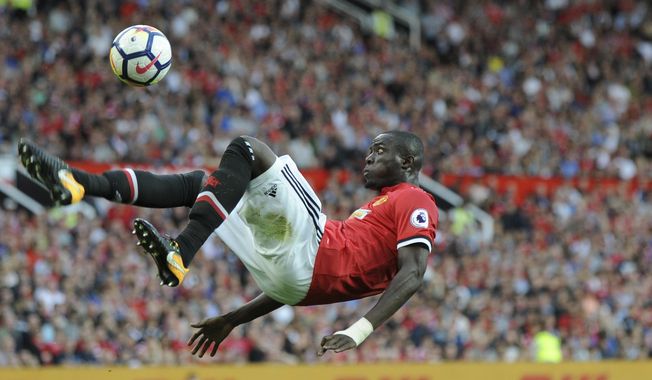 Manchester United&#x27;s Eric Bailly is airborne to kick a ball during the English Premier League soccer match between Manchester United and Leicester City at Old Trafford in Manchester, England, Saturday, Aug. 26, 2017. (AP Photo/Rui Vieira)