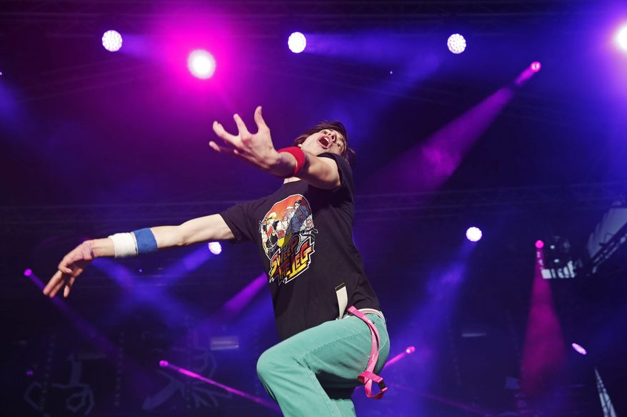 Winner American Matt "Airistotle" Burns, performs during the final of the Air Guitar World Championships in Oulu, Finland, Friday, Aug. 25, 2017. The American successfully defended his title at the 22nd Air Guitar World Championships in Oulu, Finland on Friday after competing in the finals against 15 contestants from South Korea, Pakistan, Sweden, Britain, Canada and other countries. (Eeva Rihel/Lehtikuva via AP)