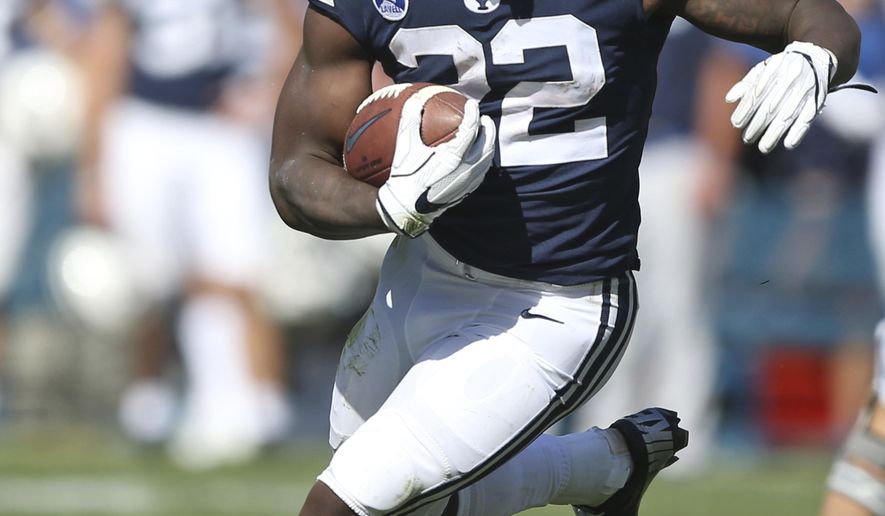 BYU running back Squally Canada (22)in the second half of an NCAA college football game against Portland State, Saturday, Aug. 26, 2017, in Provo, Utah. (AP Photo/Rick Bowmer)