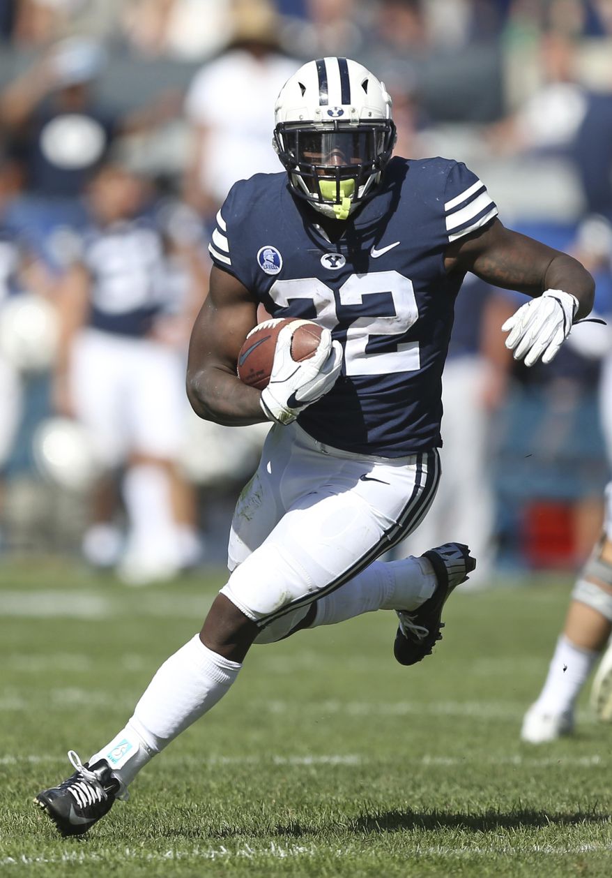 BYU running back Squally Canada (22)in the second half of an NCAA college football game against Portland State, Saturday, Aug. 26, 2017, in Provo, Utah. (AP Photo/Rick Bowmer)