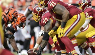 Washington Redskins offensive line at the line scrimmage during a preseason NFL football game between the Cincinnati Bengals and Washington Redskins, Sunday, Aug. 27, 2017, in Landover, Md. (AP Photo/Mark Tenally)